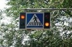 Al aproximarse a un semáforo con una o dos luces amarillas intermitentes, ¿qué hay que hacer?