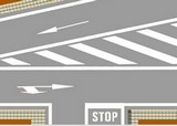 En esta zona cebreada, ¿pueden los conductores de automóviles circular o pararse sobre ella?
